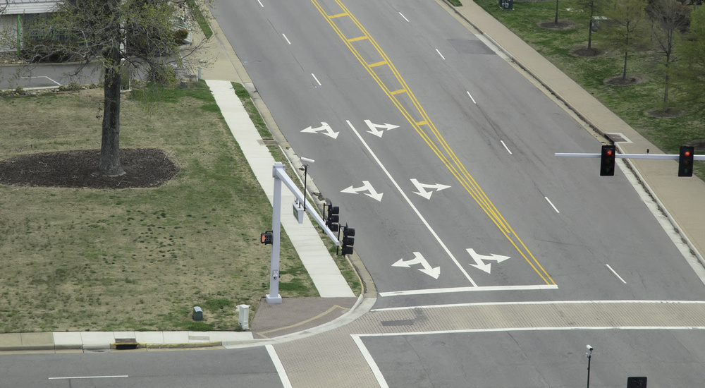 Arrow signs at intersection of city streets